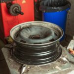 Technician replacing trailer wheel hub roadside